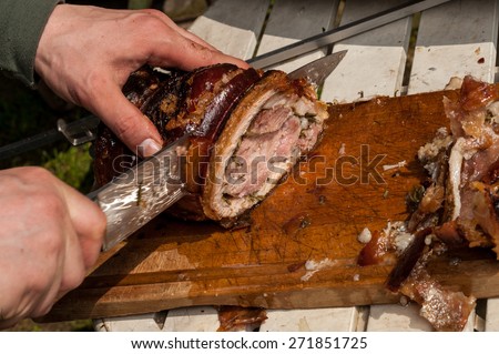 Pork cut in slices on cutting board