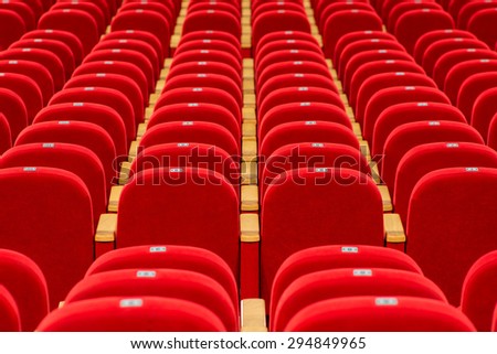empty red chairs in a theater or cinema