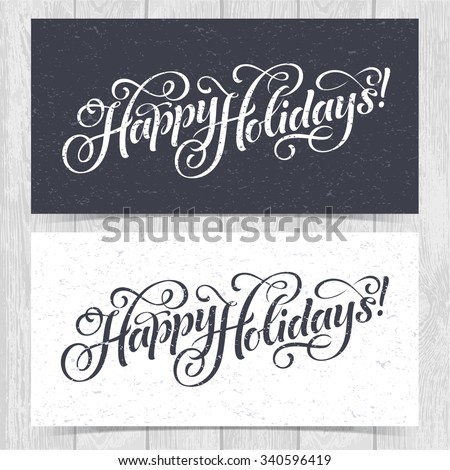Vector illustration of paper cards with Happy Holidays lettering and ornamental elements. Christmas calligraphy on wood background.
