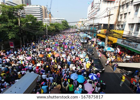 BANGKOK - DECEMBER 9 : Protesters hold an anti-government rally on December 9, 2013 at Victory Monument . They blow whistles to make symbolic protest against the amnesty bill.