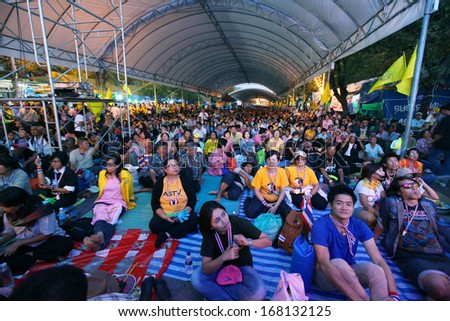 BANGKOK - DECEMBER 9: The big group of protesters sit in big tent and wait for the leader to lead them on Makkhawan Intersection on December 9, 2013 in Bangkok, Thailand.