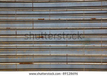 worn metal garage door gate,store roller shutter in Thailand