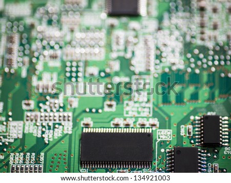 Electronic chip on circuit board with selective focus on chip.