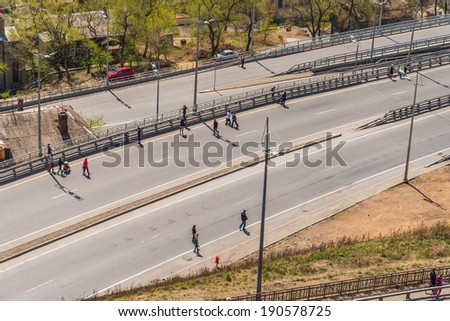 VLADIVOSTOK, RUSSIA - MAY 1, 2014: Citizens walk on \