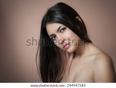 Portrait of a beautiful young brunette. Selective soft focus.