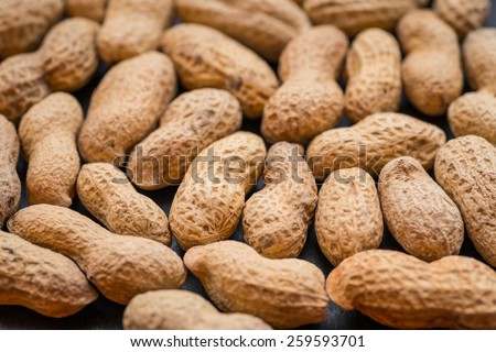 Natural looking roasted peanuts. Selective focus.