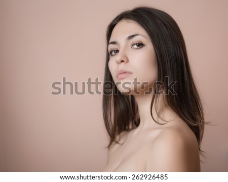 Portrait of a beautiful young brunette. Selective soft focus.