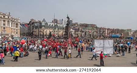 VLADIVOSTOK, RUSSIA - MAY 1, 2015: Citizens walk in International Workers\' Day event. International Workers\' Day is a celebration of labour and the working classes.