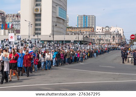 VLADIVOSTOK, RUSSIA - MAY 9, 2015: Immortal Regiment - public action, which takes place in Russia and some countries of CIS and foreign countries on the Victory Day.