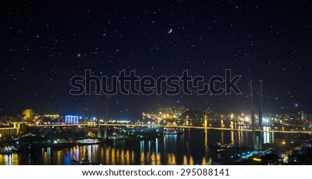 City landscape at night with sky with stars and moon.
