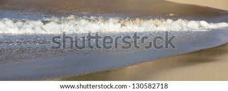 wave foam in a line.  St Martin. Caribbean. copy space