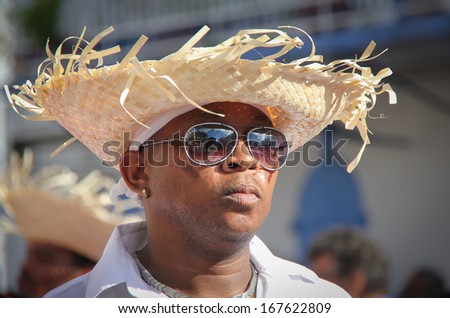 MARIGOT, ST MARTIN - FEBRUARY 10 :   Man in a straw hat at Carnival on February 10, 2013 in Marigot, St Martin