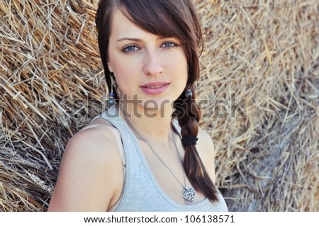 Beautiful polish girl on haystack background