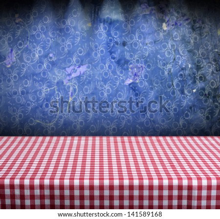Background with table and vintage blue wallpaper