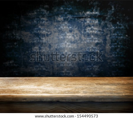 Empty Wooden Table And Dark Blue Wall With Ornaments In Background