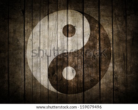 The Ying Yang sign painted on wooden wall The Ying Yang sign painted on wooden wall