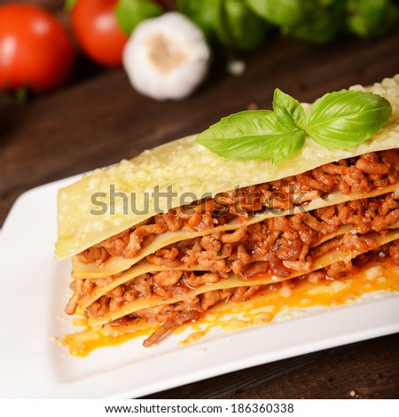 Tasty lasagne with meat, cheese and sauce