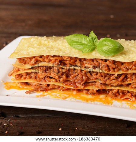 Tasty lasagne with meat, cheese and sauce