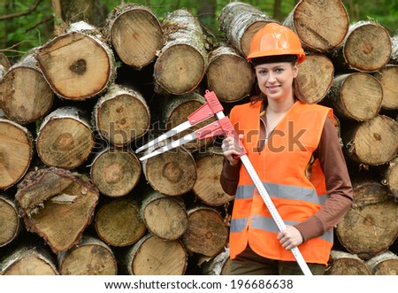 Young and beautiful forestry engineer at work