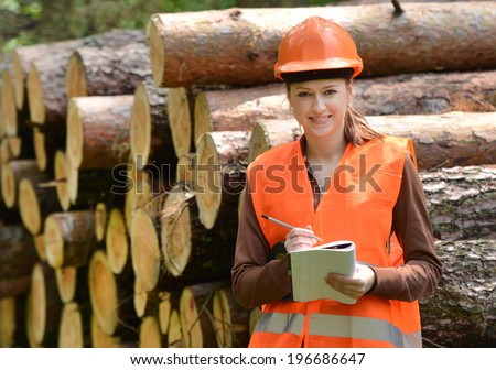Young and beautiful forestry engineer at work