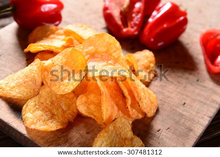 Paprika Potato Chips on rustic background