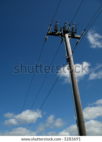 power lines in front of the blue sky