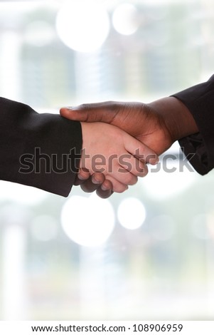 Young men shaking hands