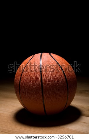 A basket ball on a court ready for the game