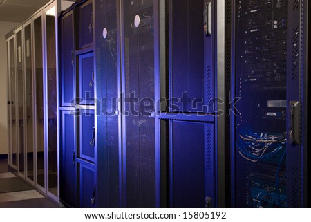 A server room with racks and computer terminals