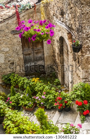 Calascio (L'Aquila, Abruzzi, Italy) - House with plants and flowers in the old village