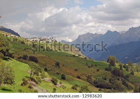 Landscape of the Engadine Valley (Switzerland) at summer and Guarda, ancient town