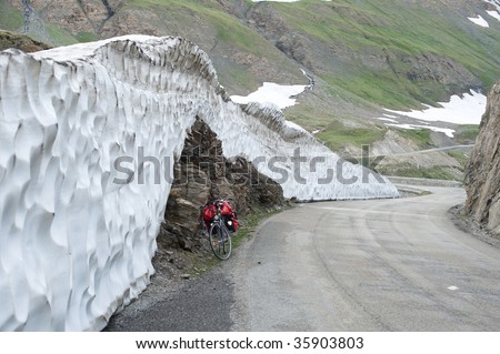 Col de l\'Iseran (Rhone-Alpes, France) - The road at summer with a bicycle