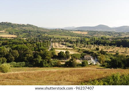 Maremma (Tuscany, Italy), country landscape with thermal bats at summer near Saturnia
