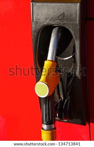 Detail of hoses of petrol pump at a gas station