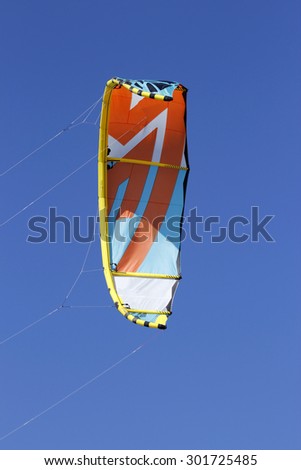 Kitesurfing or windsurfing on a very windy day in the sea