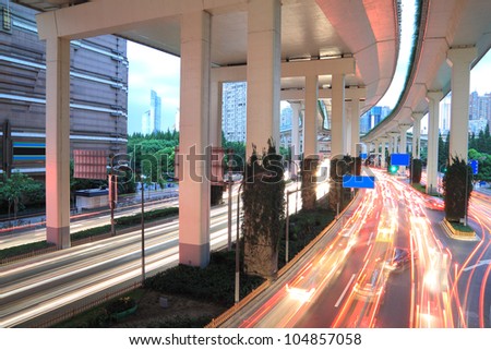 Long exposure photo Shanghai high-speed urban viaduct construction night view car light trails