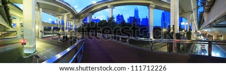 Long exposure panoramic photo High-speed urban viaduct construction background at night