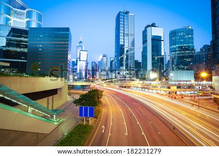 Highway car light trails of modern urban buildings in Hong Kong