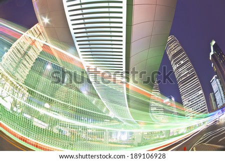 The highway bridge light trails on the modern building background in shanghai china