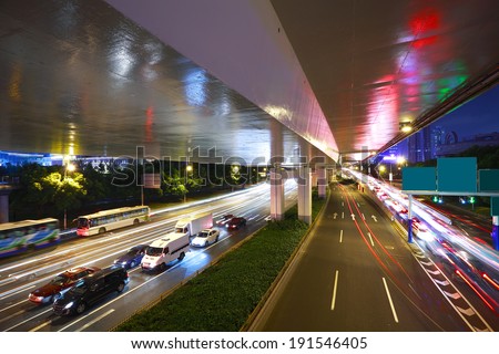 Long exposure photo High-speed urban viaduct construction background at night