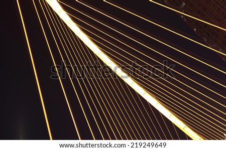 Arc type concept harp cable bridge of highway car light trails city night landscape Close-up