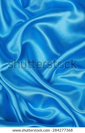 Blue silk texture satin velvet material or elegant wallpaper design curve