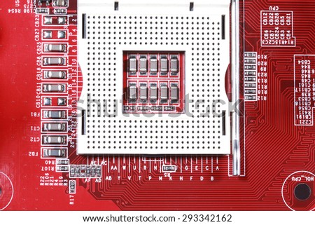Close-up of red electronic motherboard circuit board with processor