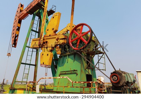 Golden yellow Oil pump oil rig energy industrial machine for petroleum crude