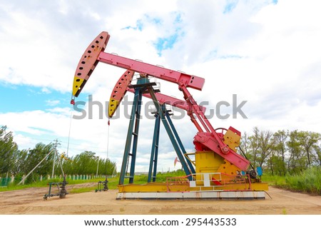 Pink Oil pump oil rig energy industrial machine for petroleum crude of countryside,dirt road