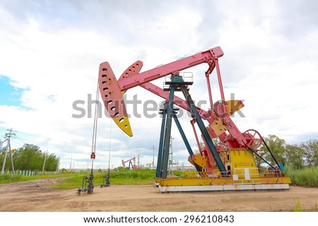 Pink Oil pump oil rig energy industrial machine for petroleum crude of countryside dirt road