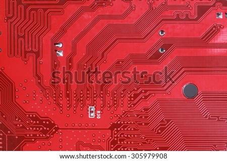close-up of electronic circuit red board background