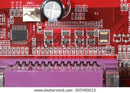 Close-up of electronic circuit red board with processor