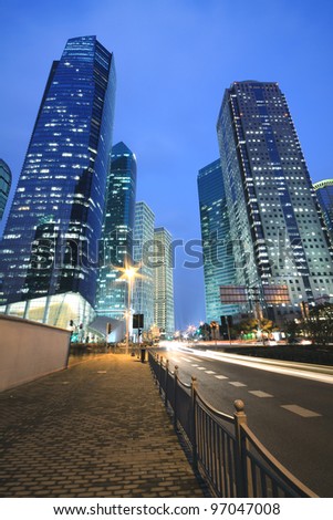 Dreamy blue of modern office buildings at night in Far East