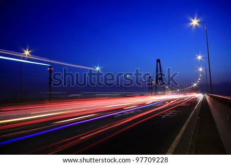 Large city road night scene, night car rainbow light trails